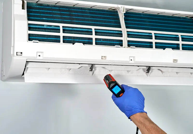 montreal-canada-may-technitian-checking-temperature-infrared-thermometer-inside-gree-air-conditioner-gree-electric-184025868